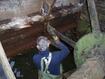 Removing old iron buckets from the waterwheel